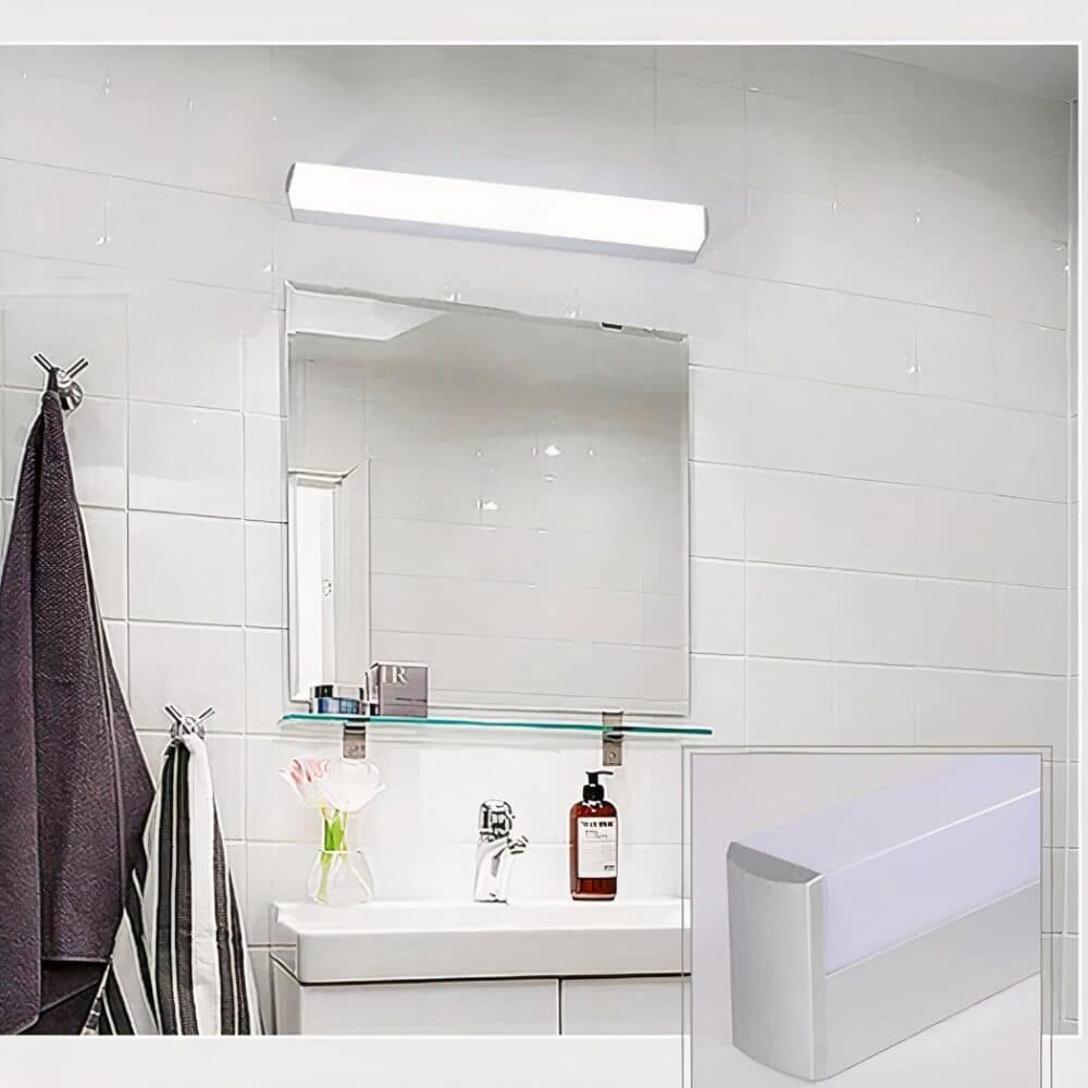 on voit dans une salle de bain blanche au dessus du miroir une applique murale néon basique blanche