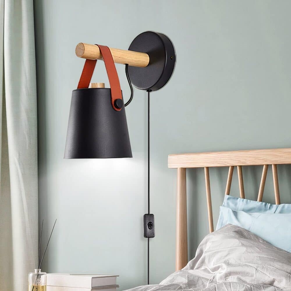 Applique murale filaire style nordique abat jour noir fixé sur le mur d'une chambre