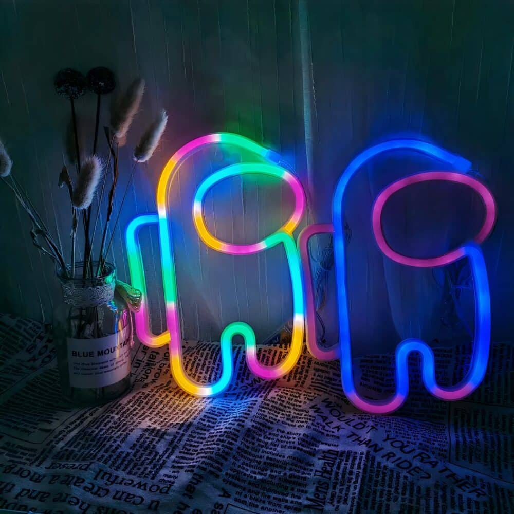 Applique murale néon Among Us allumée et sur fond noir.